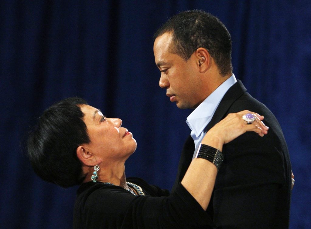 Golfer Tiger Woods hugs his mother Kultida Woods after making a statement from the Sunset Room on the second floor of the TPC Sawgrass, home of the PGA Tour on February 19, 2010 in Ponte Vedra Beach, Florida.