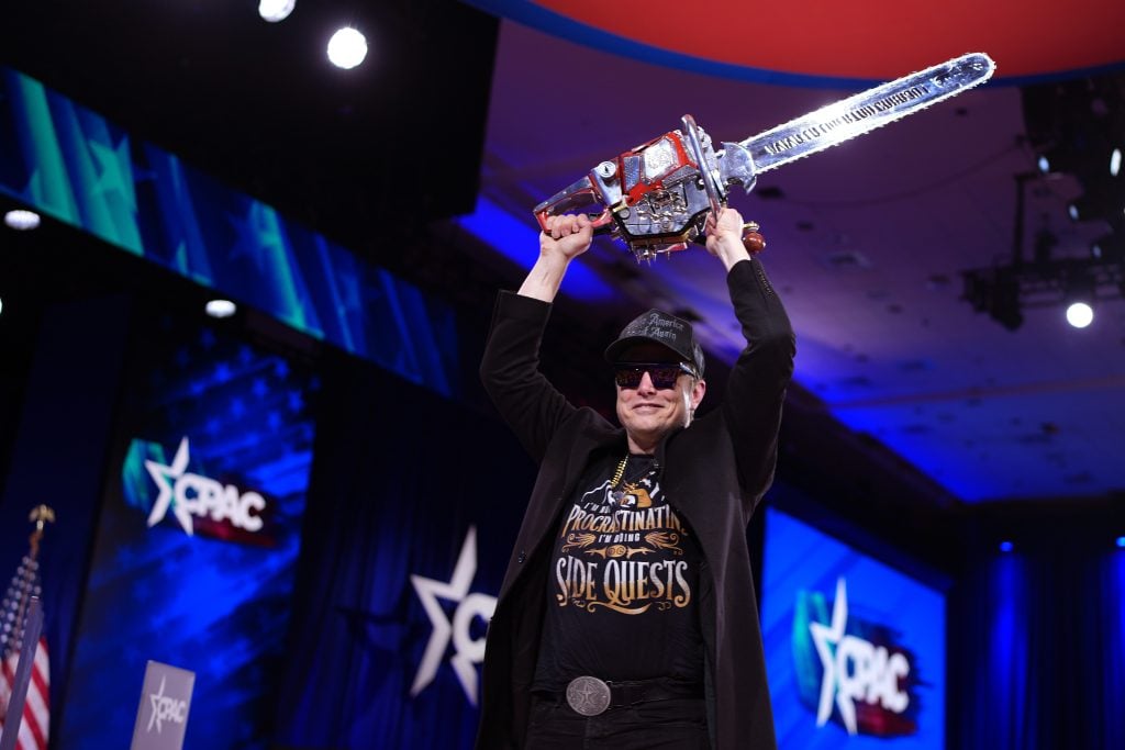 CEO of Tesla and SpaceX Elon Musk leaves the stage holding a chainsaw after speaking at the Conservative Political Action Conference (CPAC) at the Gaylord National Resort Hotel And Convention Center on February 20, 2025 in Oxon Hill, Maryland.