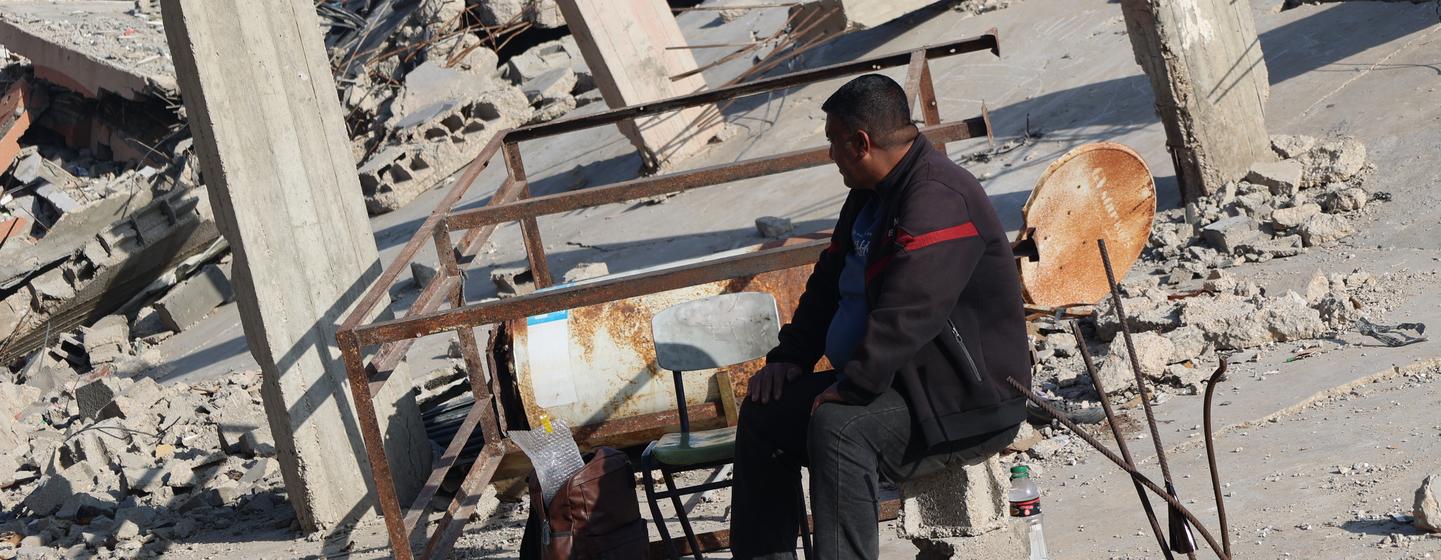 Ramadan Kutkut sits on the rubble of his house in Jabalia, in the northern Gaza Strip.