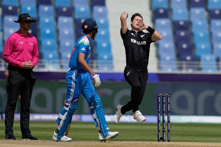 New Zealand's Matt Henry bowls a delivery during the ICC Champions Trophy cricket match between India and New Zealand at Dubai International Cricket Stadium in Dubai, United Arab Emirates, Sunday, March 2, 2025. (AP Photo/Altaf Qadri)