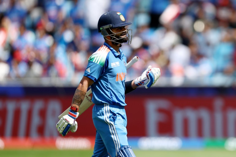 DUBAI, UNITED ARAB EMIRATES - MARCH 02: Virat Kohli of India looks dejected as he leaves the field after being dismissed during the ICC Champions Trophy 2025 match between New Zealand and India at Dubai International Cricket Stadium on March 02, 2025 in Dubai, United Arab Emirates. (Photo by Francois Nel/Getty Images)