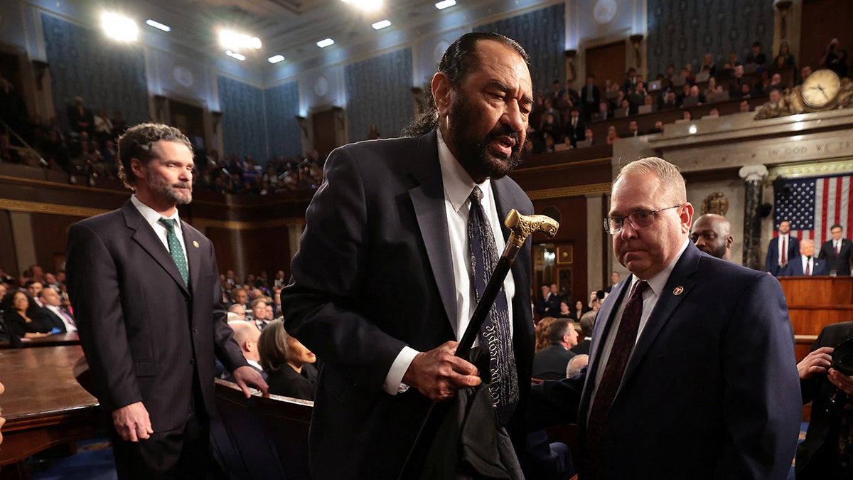 WASHINGTON, DC - MARCH 04: U.S. Rep. Al Green (D-TX) is removed from the chamber as President Donald Trump addresses a joint session of Congress at the U.S. Capitol on March 04, 2025 in Washington, DC.  