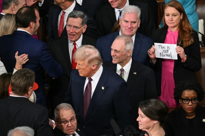 US Representative Melanie Stansbury, Democrat from New Mexico, holds a sign reading “This is not normal” as US President Donald Trump arrives to address to a joint session of Congress