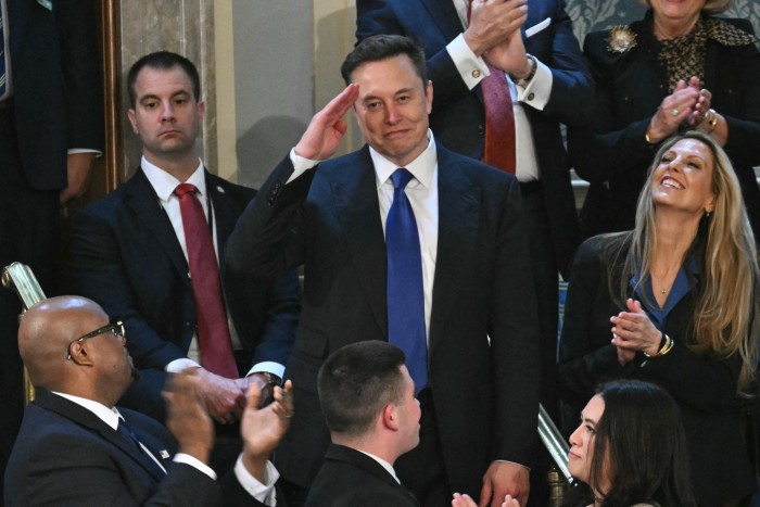 Elon Musk stands as he is recognized by US President Donald Trump during Trump’s address to a joint session of Congress