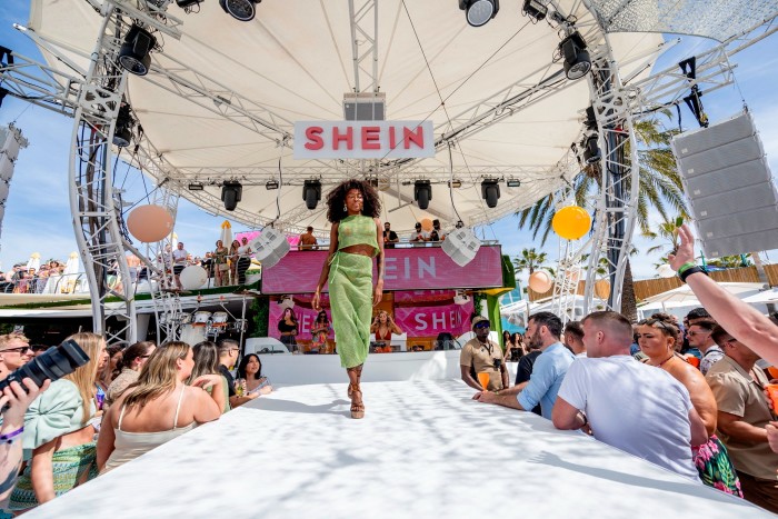 A model walks during the Shein opening party at O Beach Ibiza