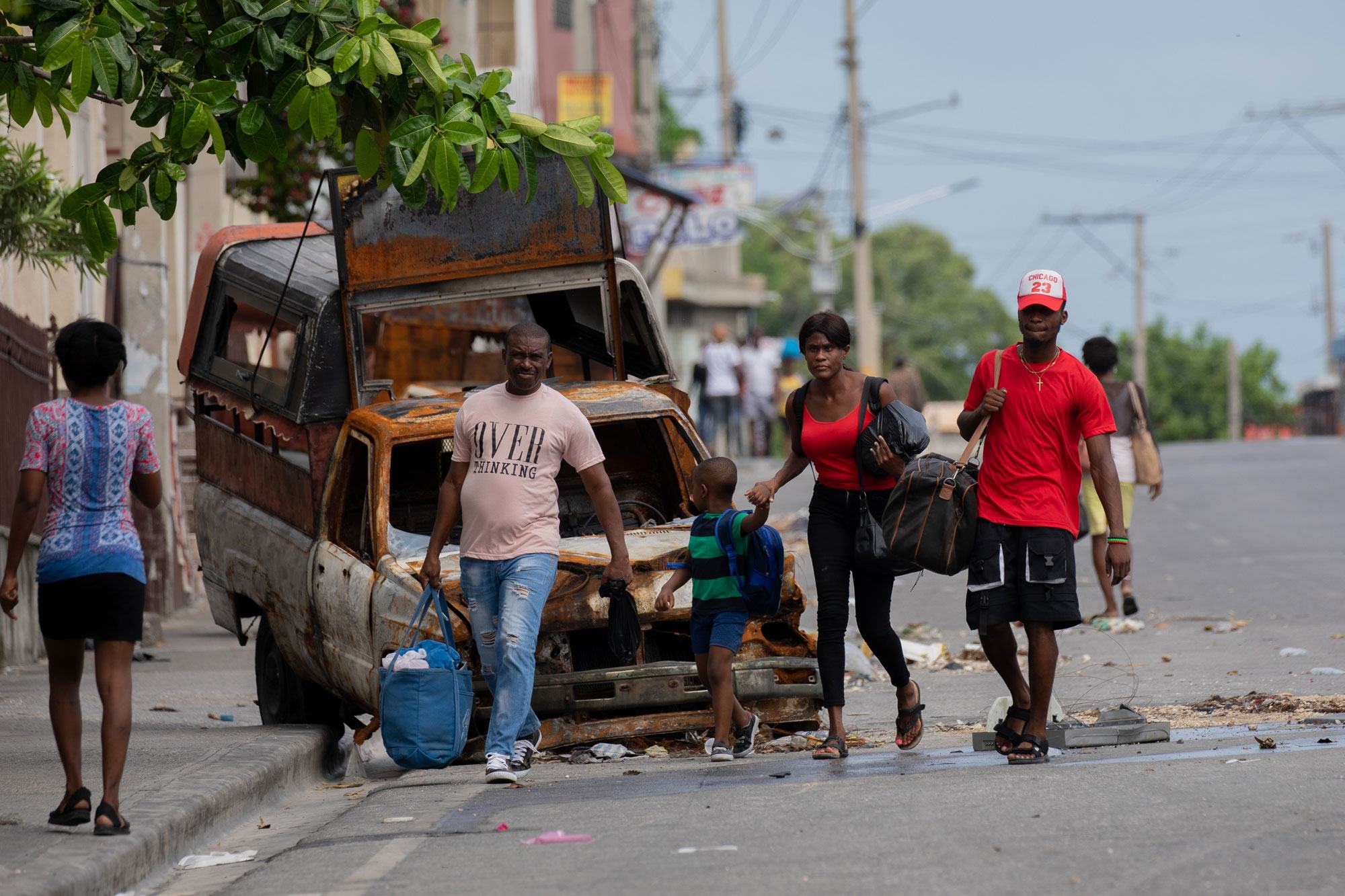 People flee the neighbourhood of Solino in Port-au-Prince following gang attacks there in May 2024.