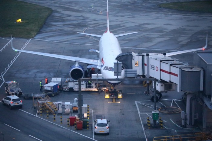 An airliner is loaded before a flight from Heathrow