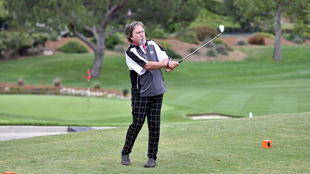Richard Karn playing golf