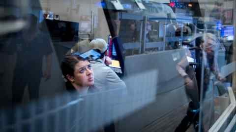Traders on the floor of the New York Stock Exchange looking at their screens